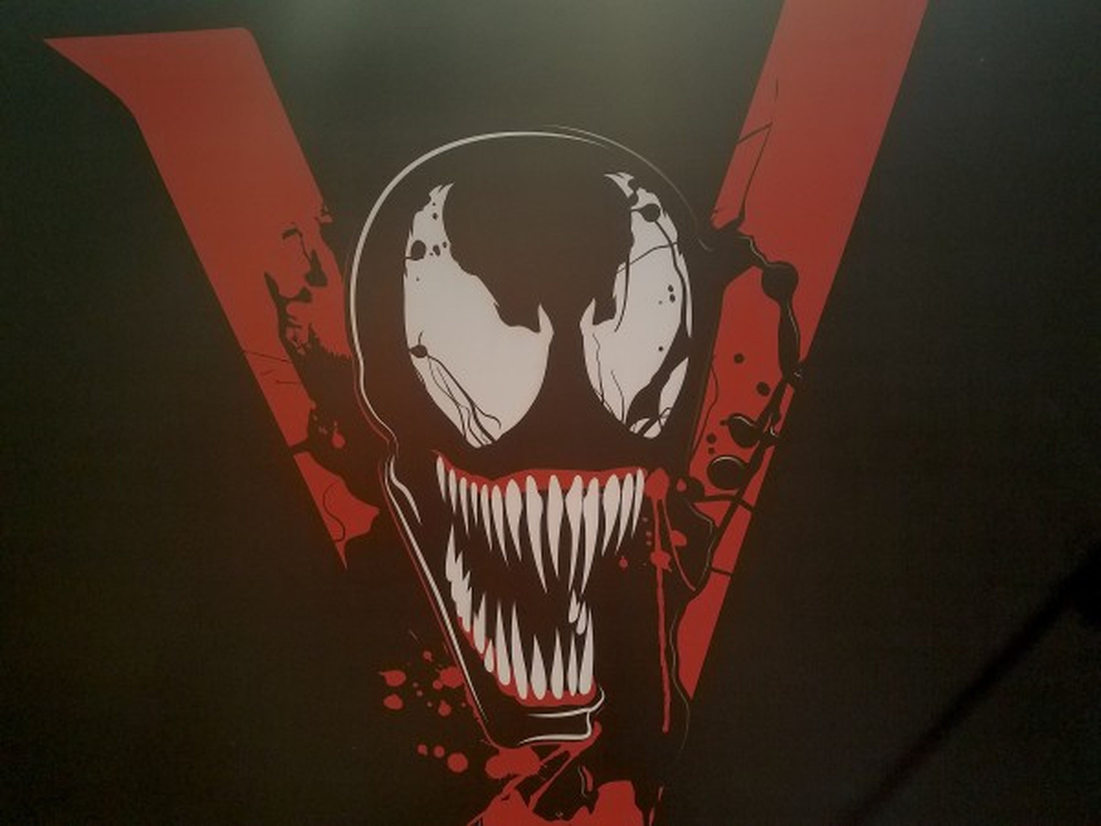 Venom logo y slogan