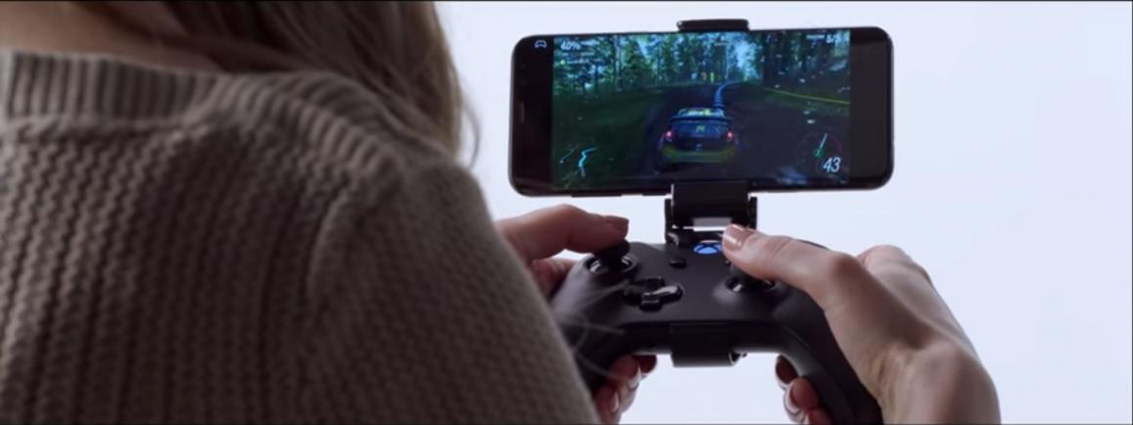 In one example Microsoft showed, a woman plays an Xbox game through Project xCloud on a smartphone connected to an Xbox One gamepad.